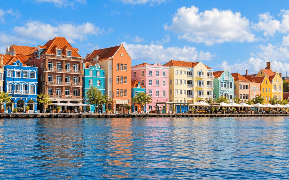 Colourful Dutch colonial Handelskade buildings along Willemstad harbour in Curaçao