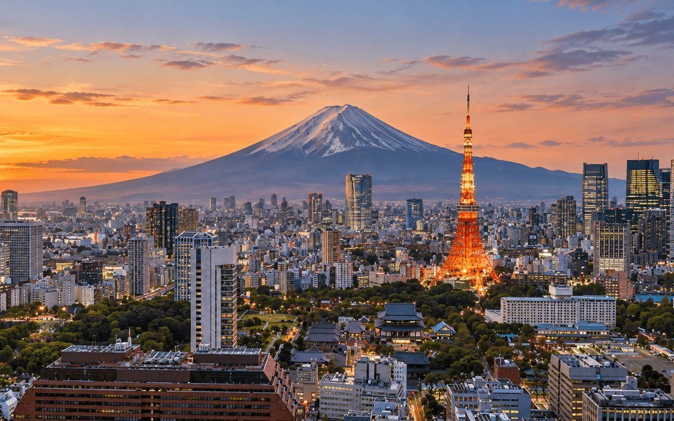 Tokyo skyline at sunset with illuminated Tokyo Tower and snow-capped Mount Fuji for international November flight deals from Dallas