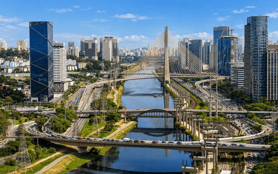Aerial view of São Paulo with the X-shaped Octávio Frias de Oliveira cable-stayed bridge crossing the Pinheiros River among glass skyscrapers