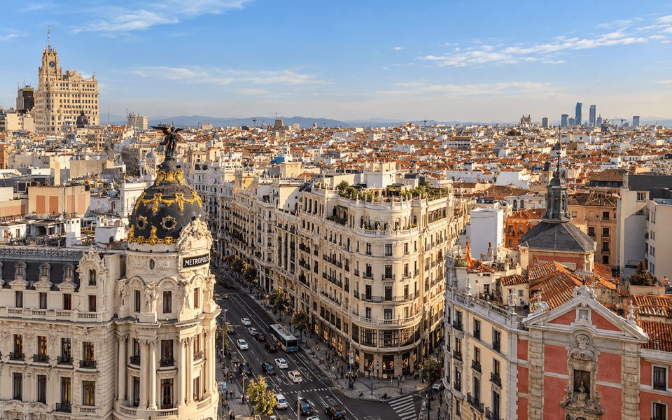 Metropolis Building at the junction of Gran Vía and Calle de Alcalá in Madrid for international November flight deals from New York